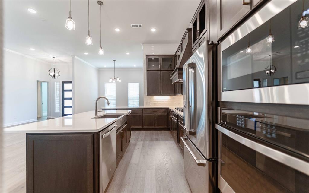 2008 Casting Ridge Mesquite, TX 75181 - Photo 11 of 24 a kitchen with stainless steel appliances granite countertop a sink a stove and a refrigerator