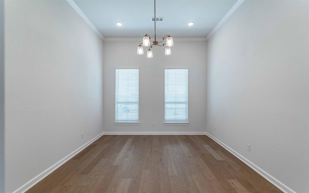 2008 Casting Ridge Mesquite, TX 75181 - Photo 12 of 24 an empty room with wooden floor and windows