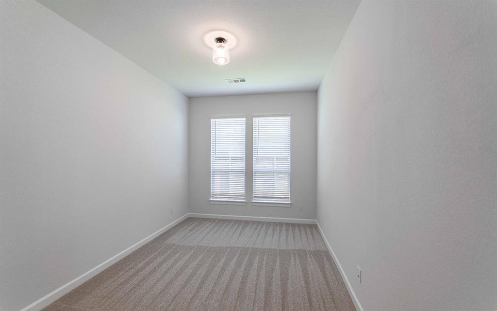 2008 Casting Ridge Mesquite, TX 75181 - Photo 21 of 24 an empty room with wooden floor and windows