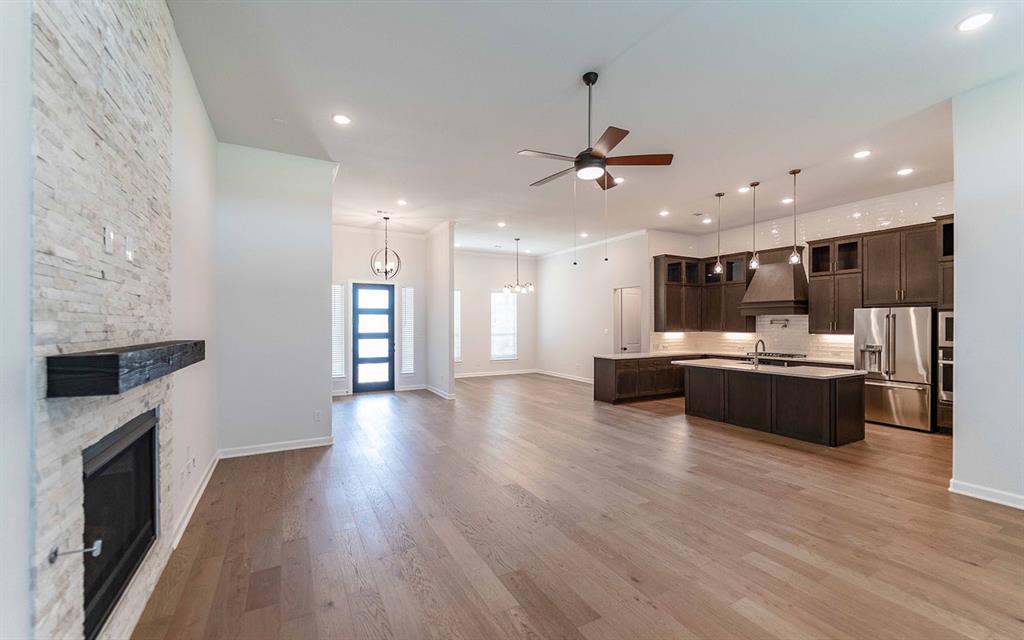 2008 Casting Ridge Mesquite, TX 75181 - Photo 3 of 24 a large kitchen with a center island and wooden floor