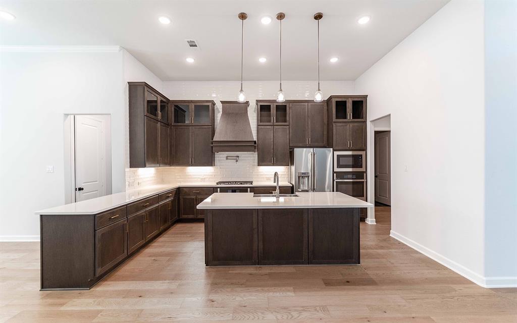 2008 Casting Ridge Mesquite, TX 75181 - Photo 7 of 24 a large kitchen with a counter top space a sink stainless steel appliances and cabinets