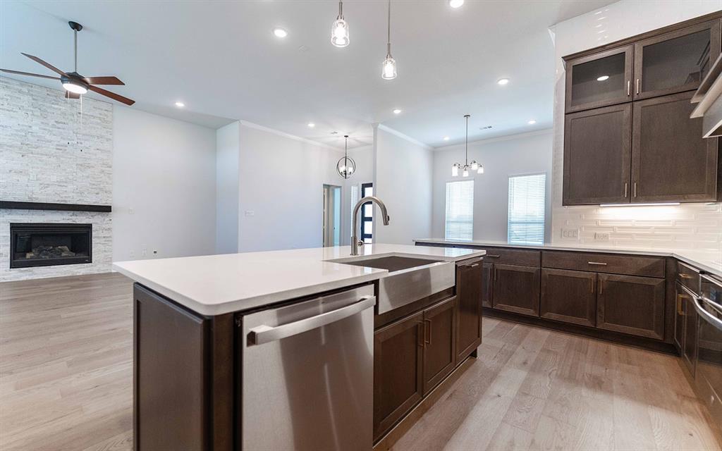 2008 Casting Ridge Mesquite, TX 75181 - Photo 10 of 24 a kitchen with stainless steel appliances granite countertop a sink a stove and a refrigerator