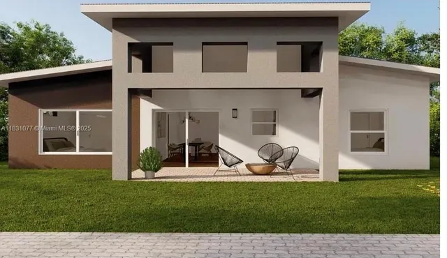 a view of a house with backyard sitting area and garden