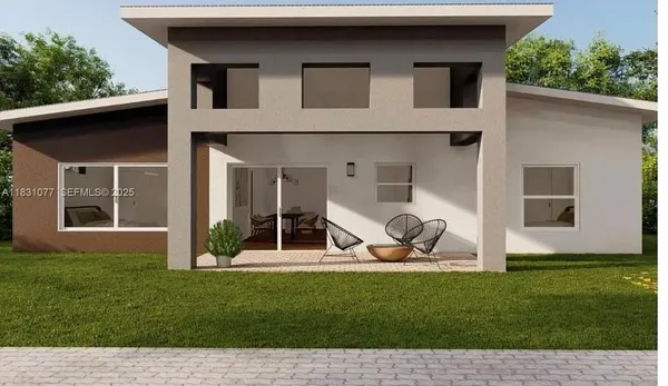 a view of a house with backyard sitting area and garden