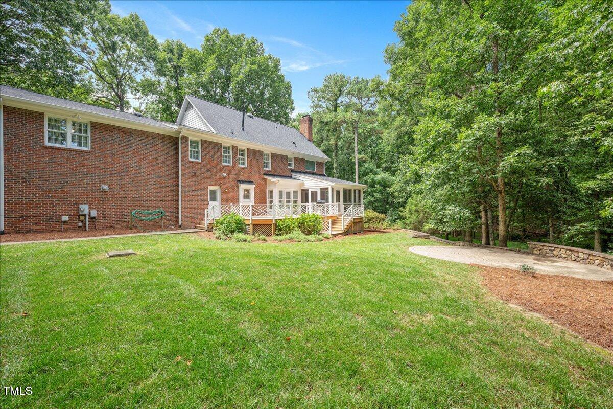 9228 Oneal Road Raleigh, NC 27613 - Photo 18 of 45 a view of a house with backyard and garden