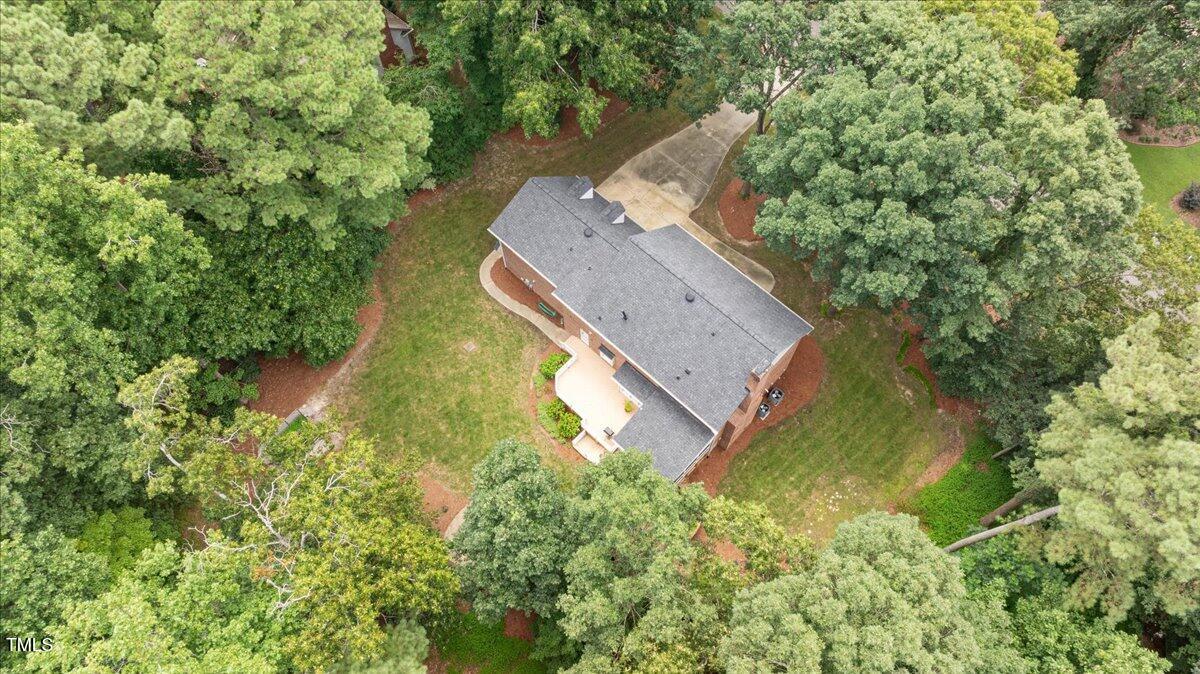 9228 Oneal Road Raleigh, NC 27613 - Photo 2 of 45 an aerial view of a house with a yard and large trees