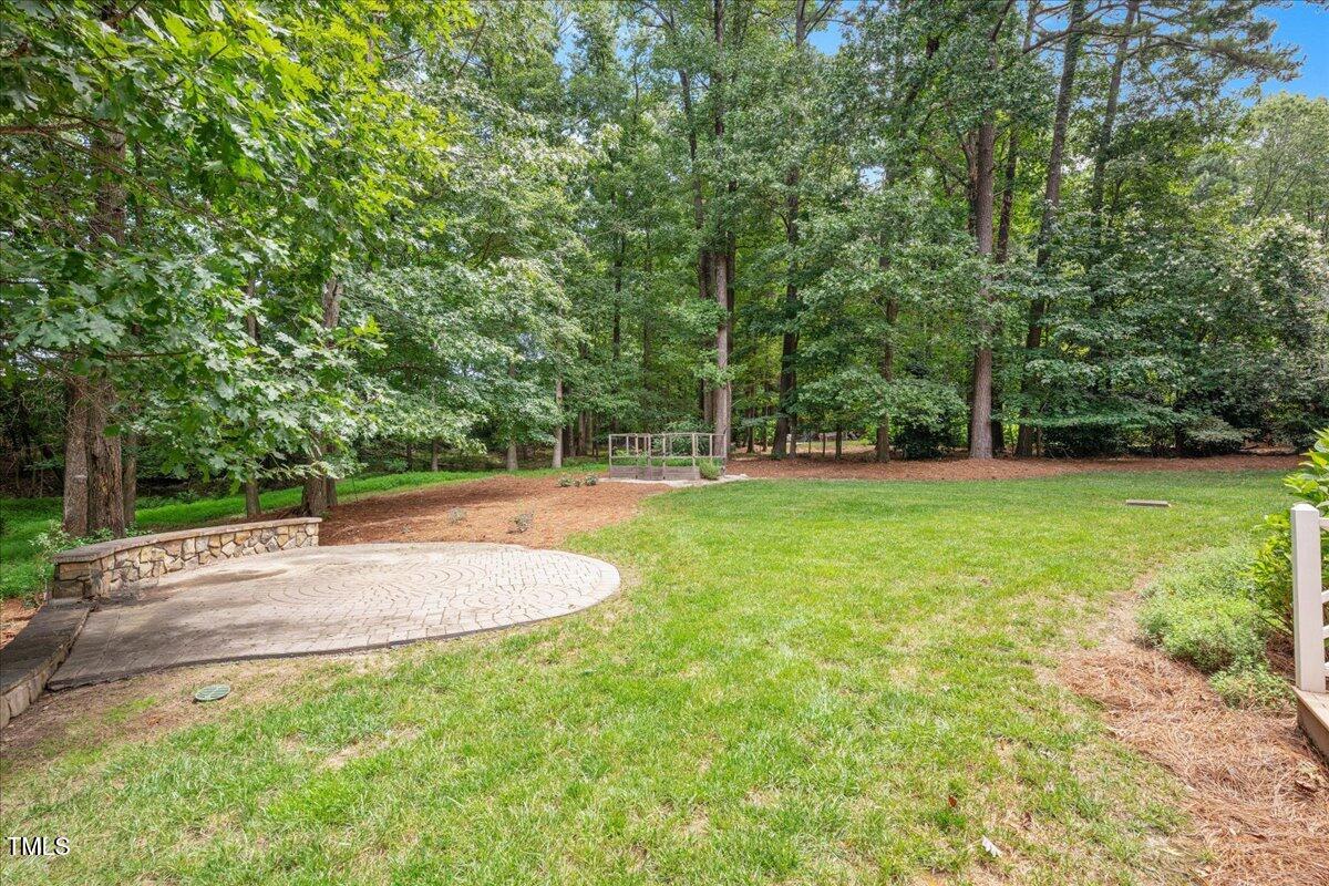 9228 Oneal Road Raleigh, NC 27613 - Photo 23 of 45 a view of outdoor space with deck and yard