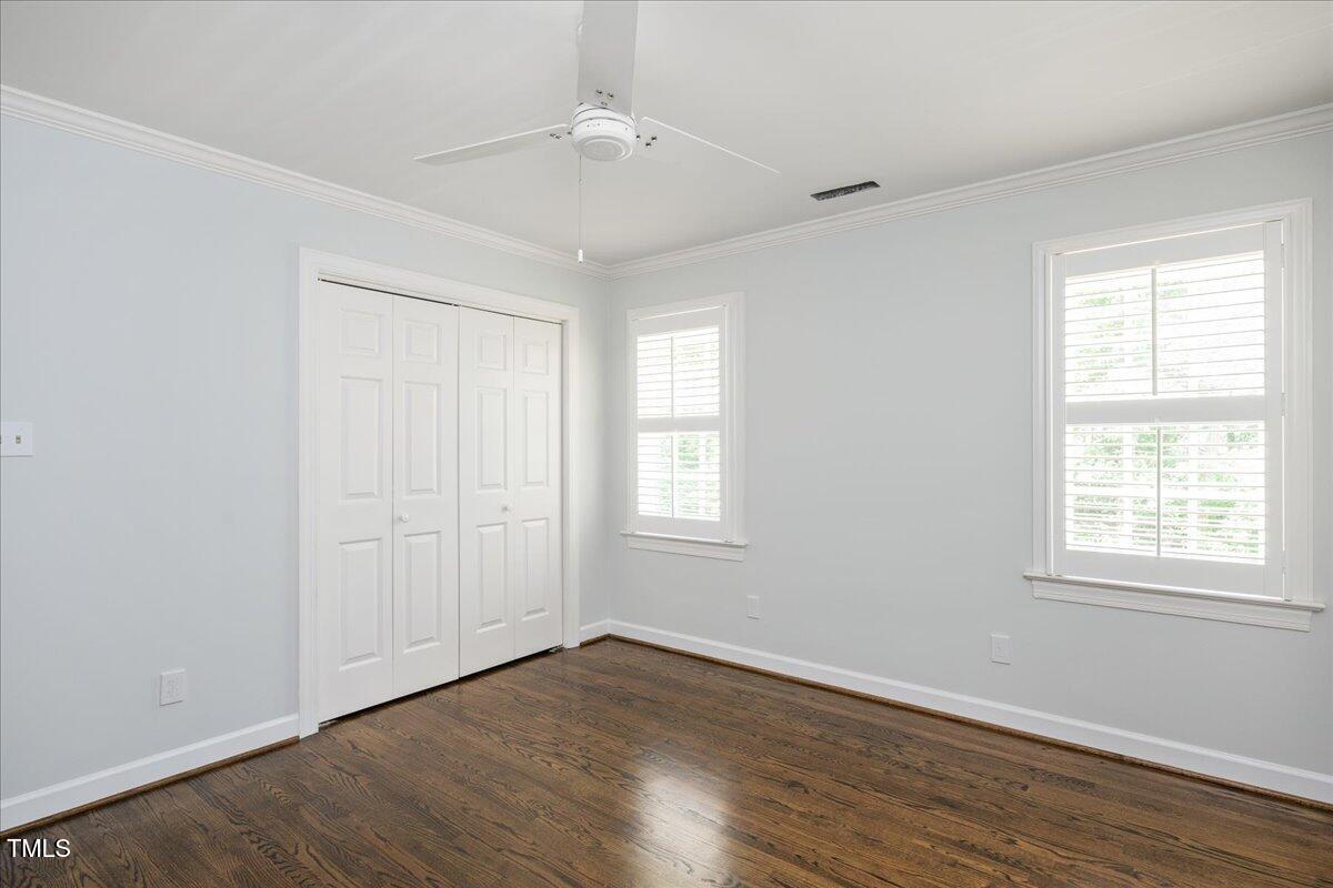 9228 Oneal Road Raleigh, NC 27613 - Photo 31 of 45 a view of an empty room with wooden floor and a window
