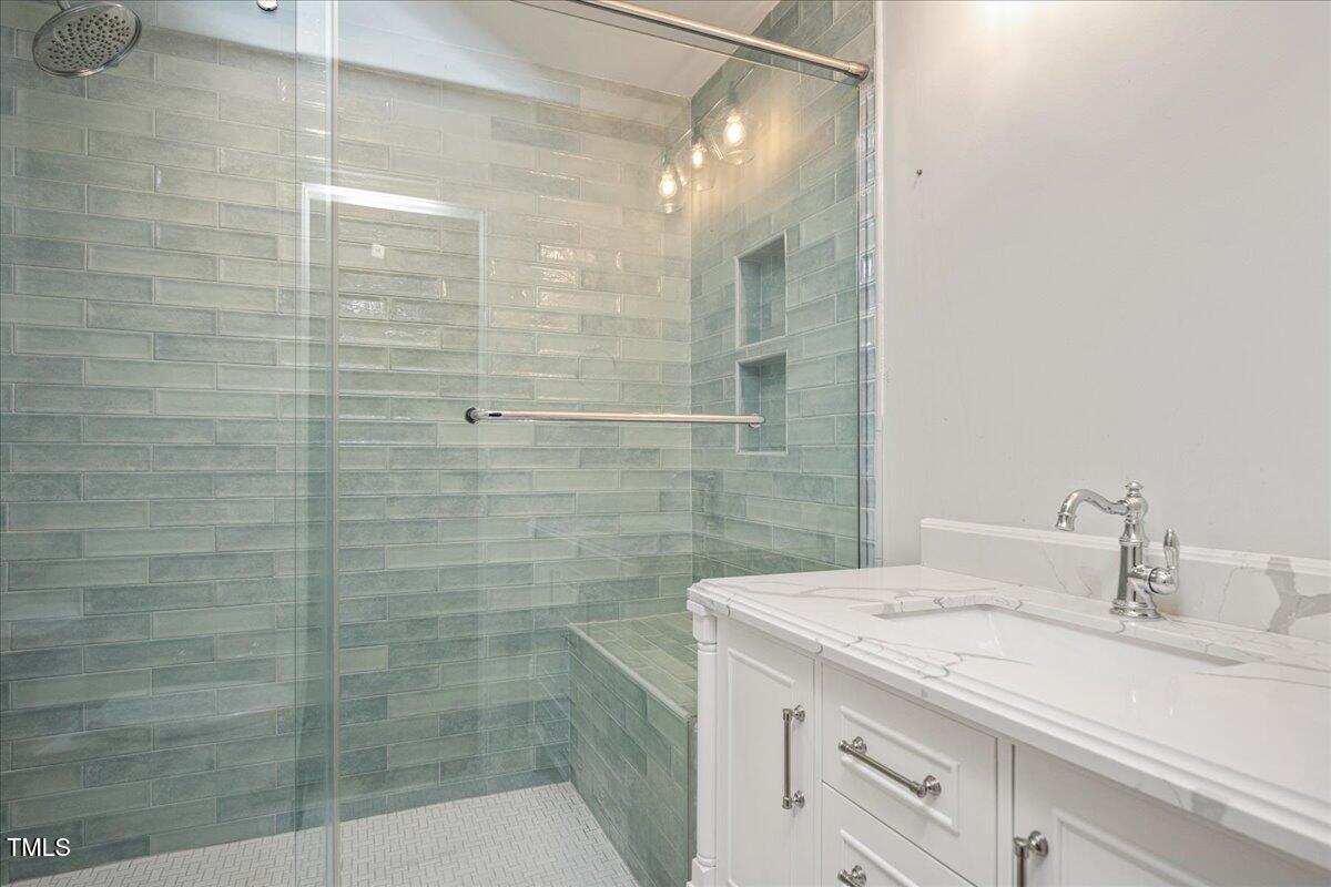 9228 Oneal Road Raleigh, NC 27613 - Photo 34 of 45 a bathroom with a shower and sink