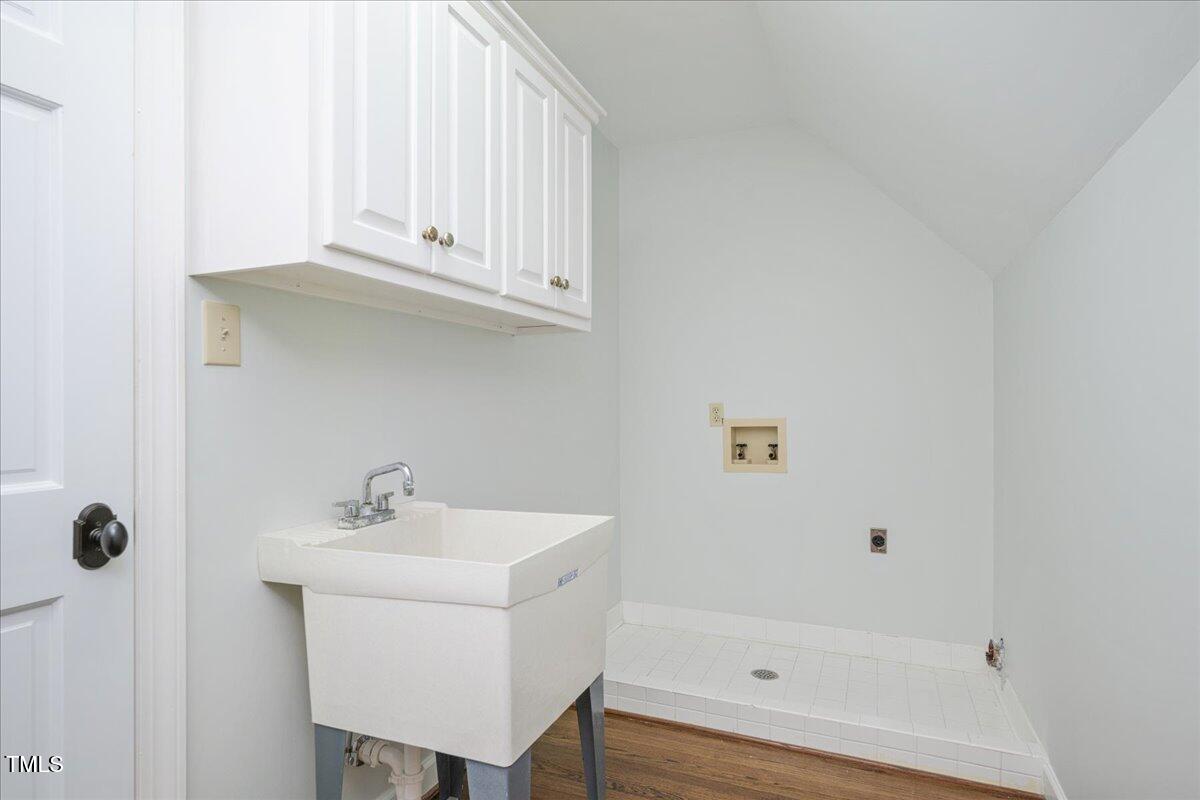 9228 Oneal Road Raleigh, NC 27613 - Photo 35 of 45 a bathroom with a sink and a mirror