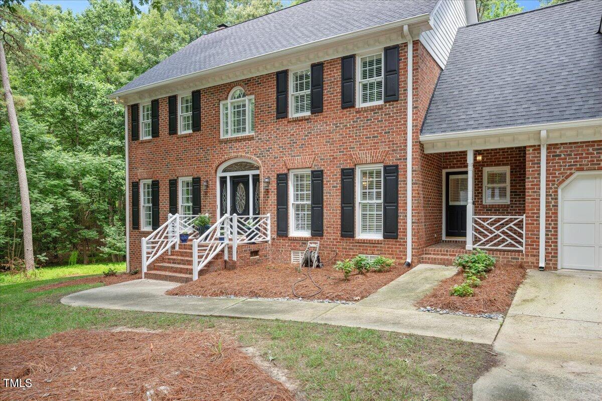 9228 Oneal Road Raleigh, NC 27613 - Photo 38 of 45 a front view of a house with garden and plants
