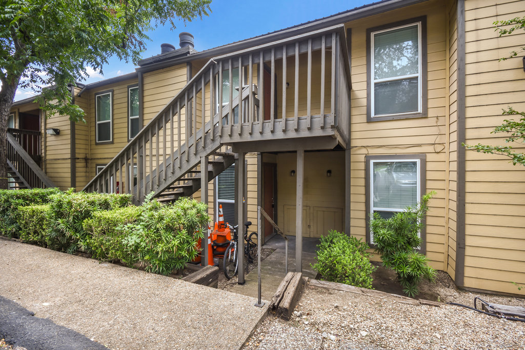 1000 West 26th Street, Unit 110 Austin, TX 78705 - Photo 12 of 12 a front view of a house with a yard