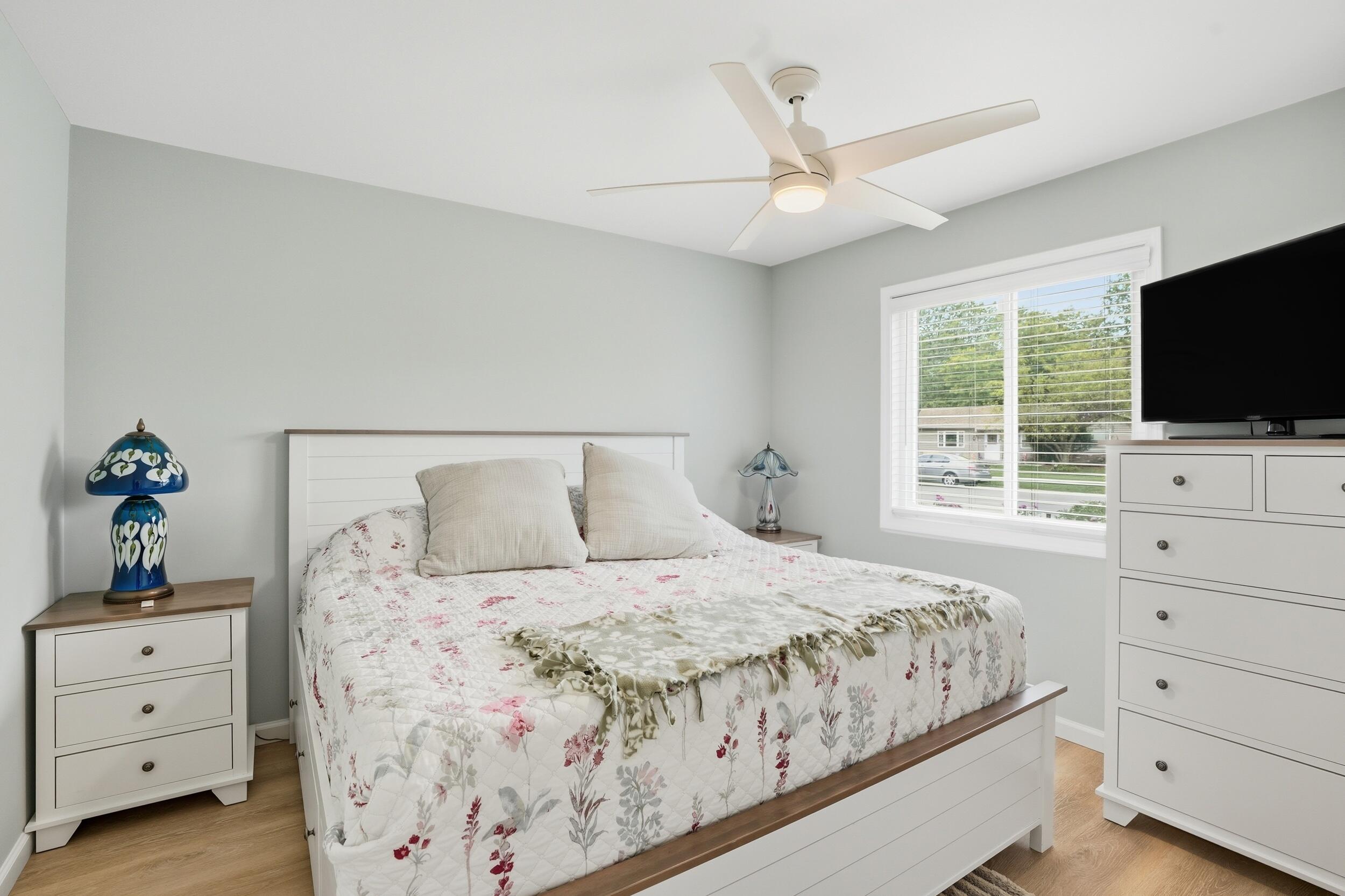 1437 Madison Avenue Dyer, IN 46311 - Photo 14 of 25 a bedroom with a bed and a flat screen tv