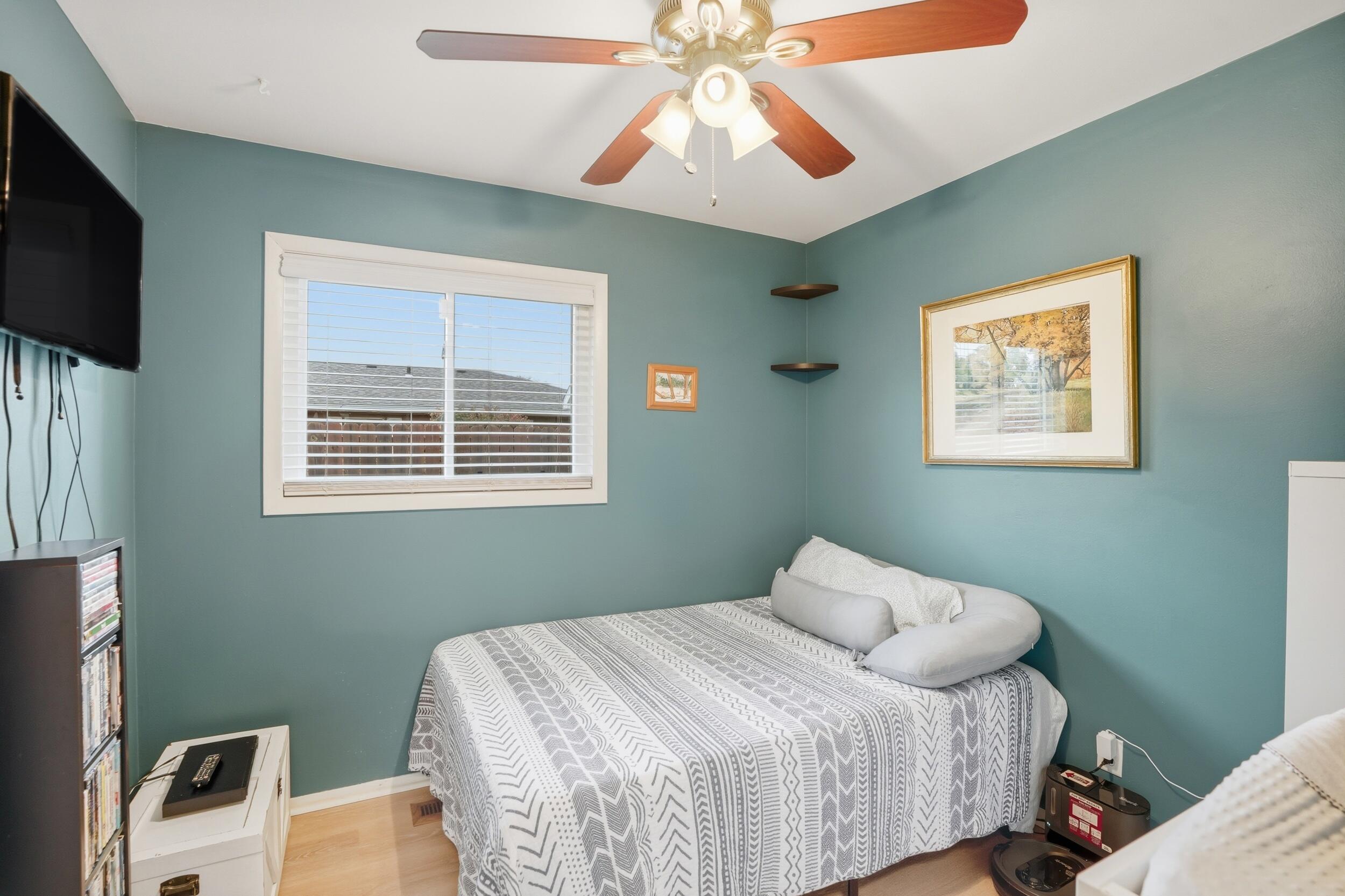 1437 Madison Avenue Dyer, IN 46311 - Photo 17 of 25 a bedroom with a bed and a flat screen tv