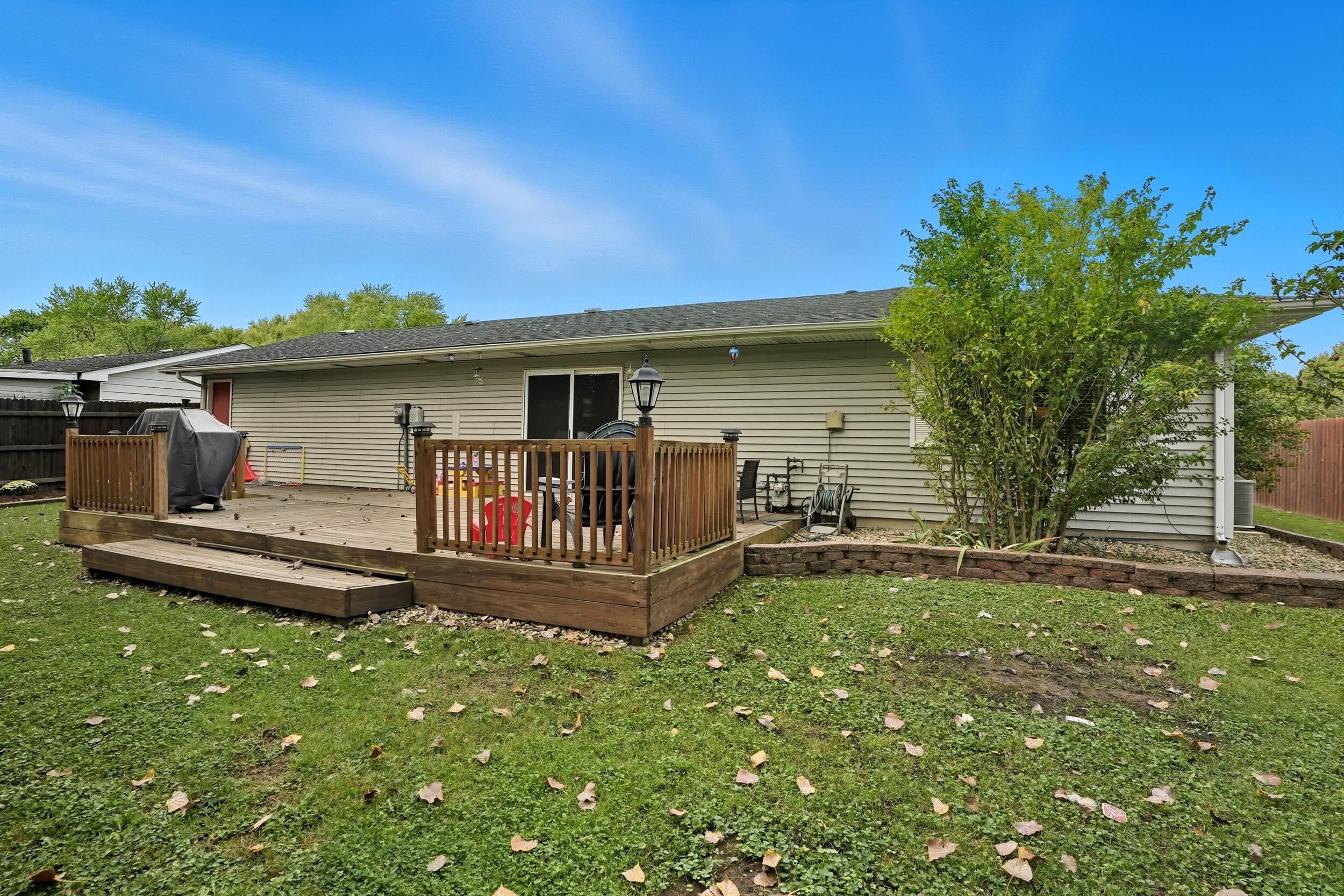 1437 Madison Avenue Dyer, IN 46311 - Photo 20 of 25 a front view of a house with garden