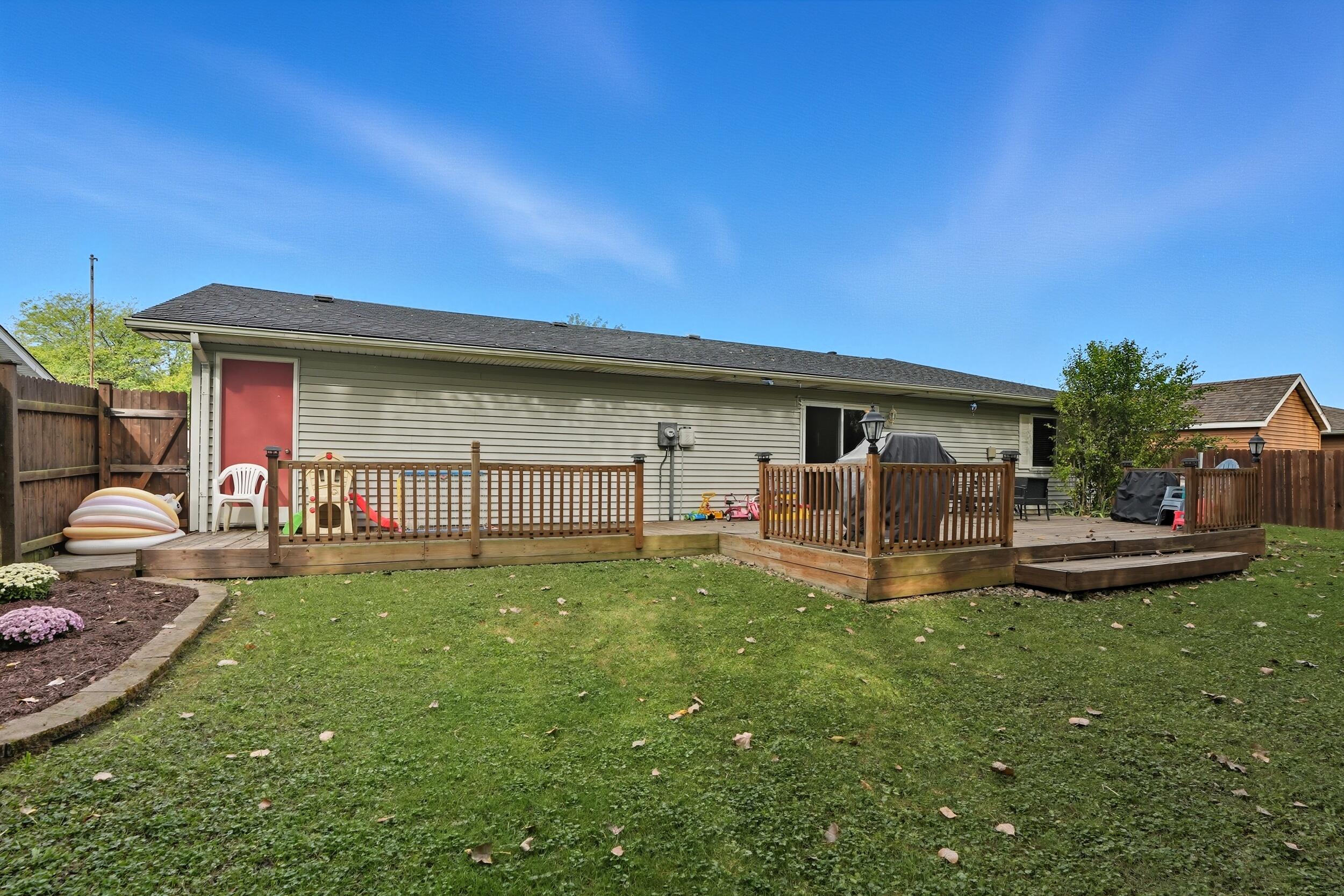 1437 Madison Avenue Dyer, IN 46311 - Photo 21 of 25 a view of a house with backyard sitting area and garden