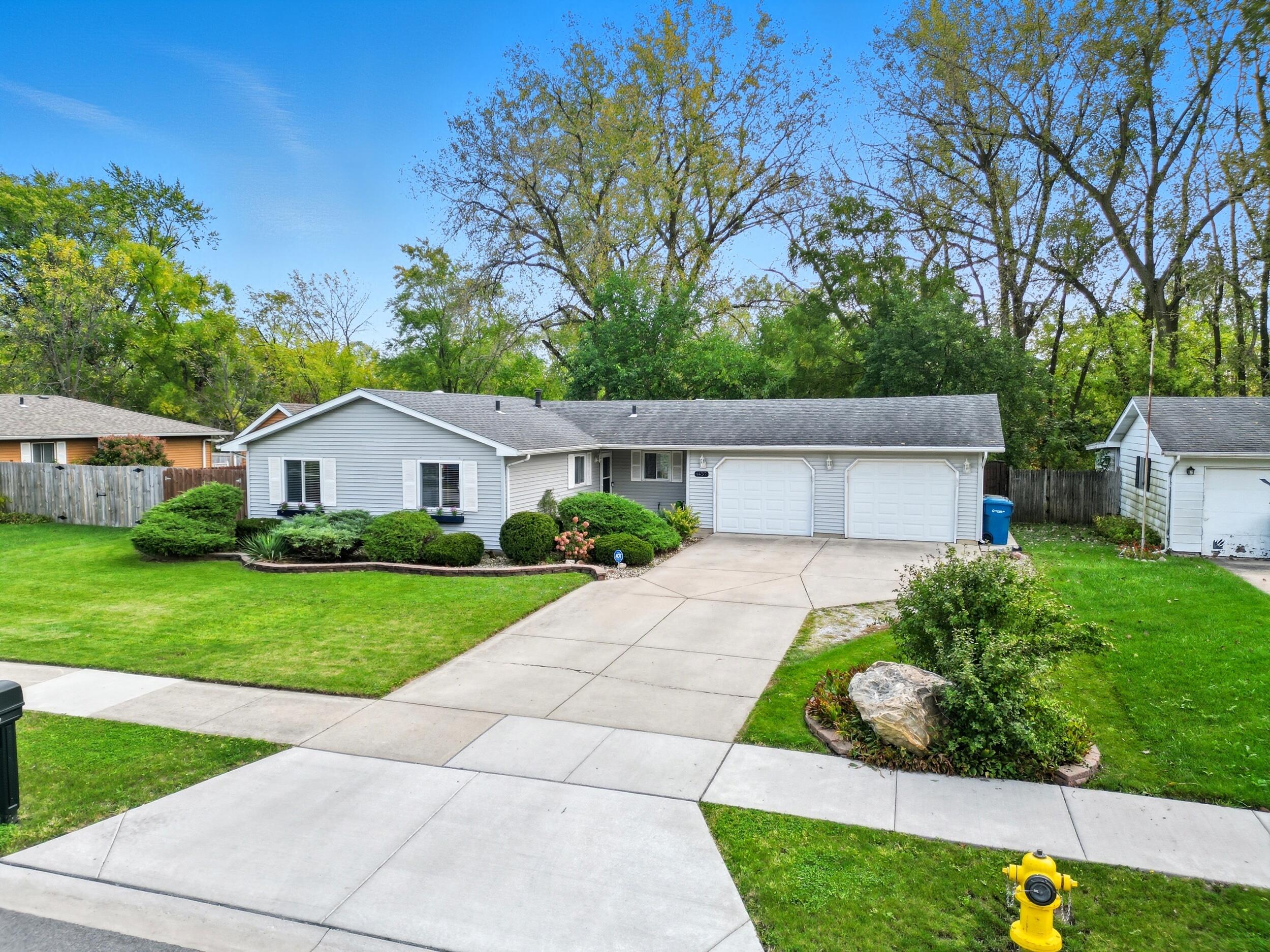 1437 Madison Avenue Dyer, IN 46311 - Photo 25 of 25 a front view of a house with a yard