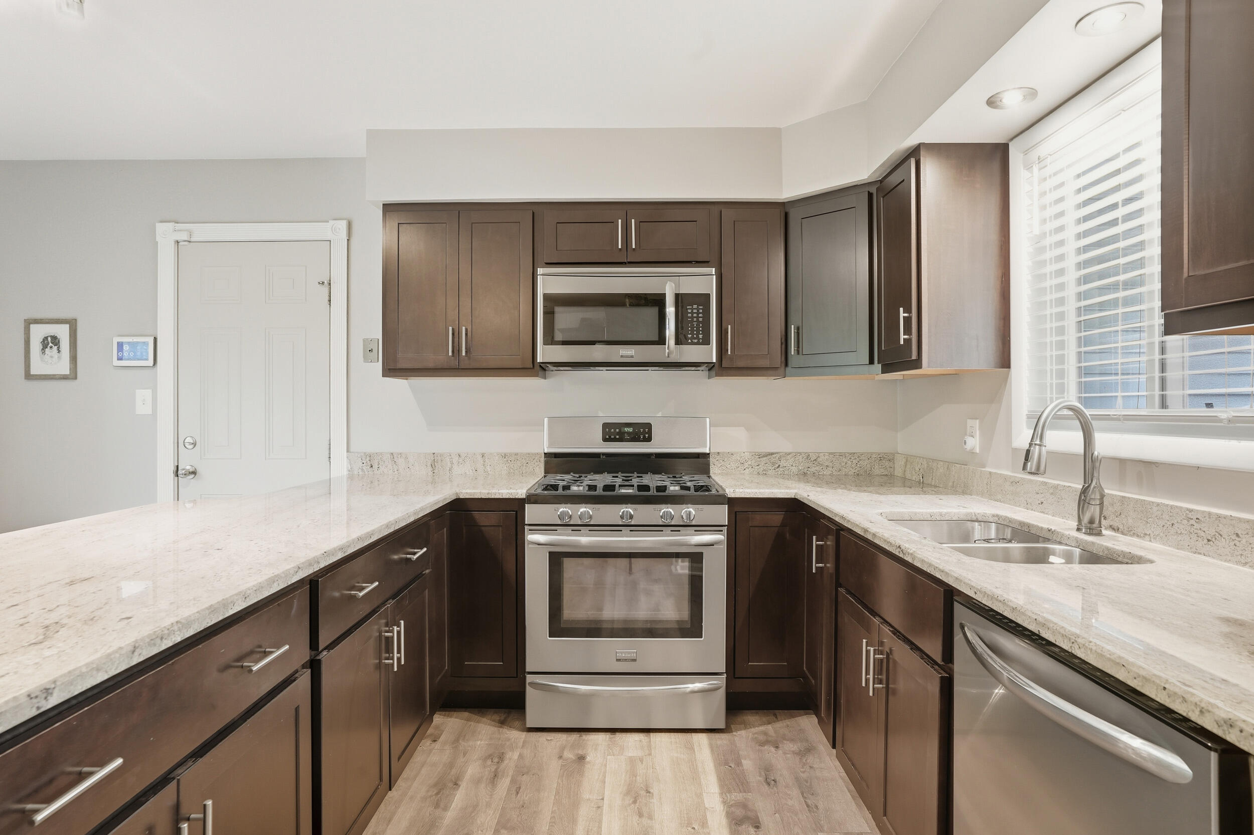 1437 Madison Avenue Dyer, IN 46311 - Photo 7 of 25 a kitchen with a stove and a sink