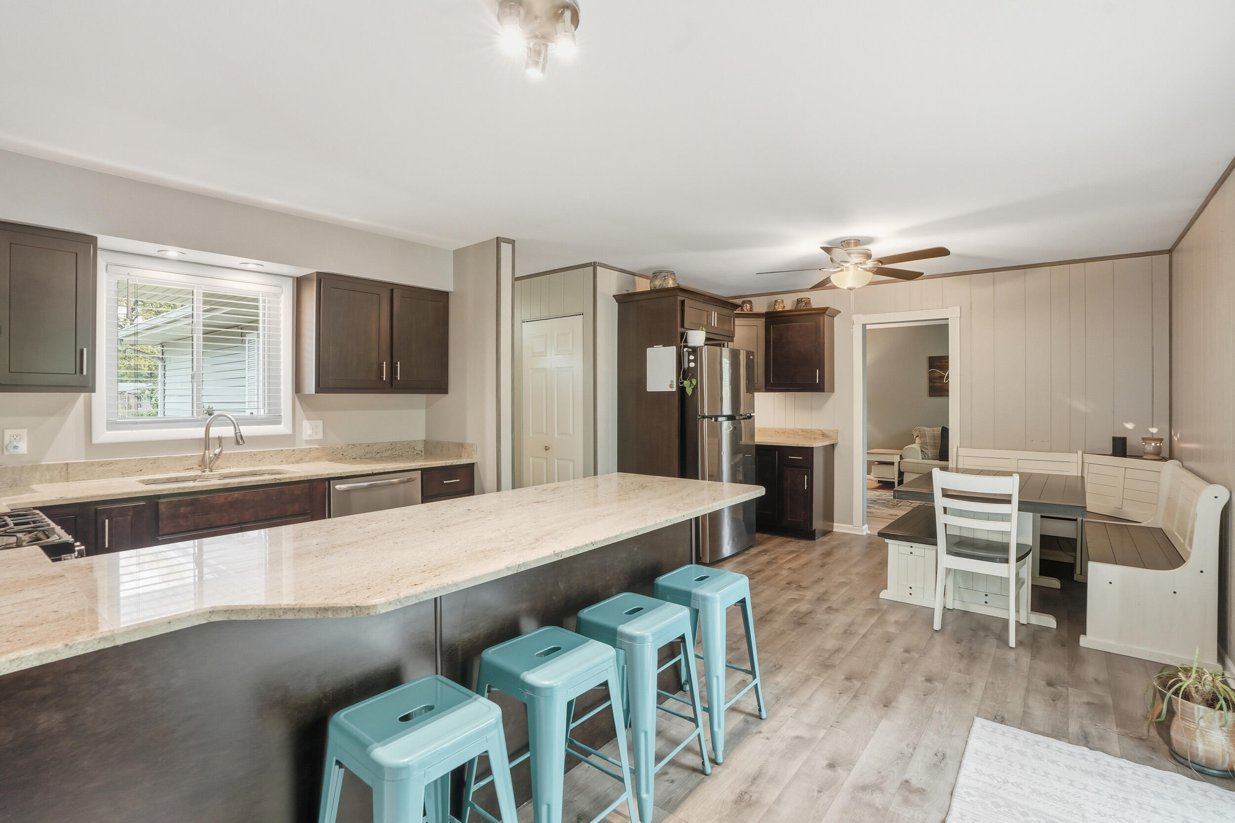 1437 Madison Avenue Dyer, IN 46311 - Photo 9 of 25 a large living room with furniture a flat screen tv and kitchen view