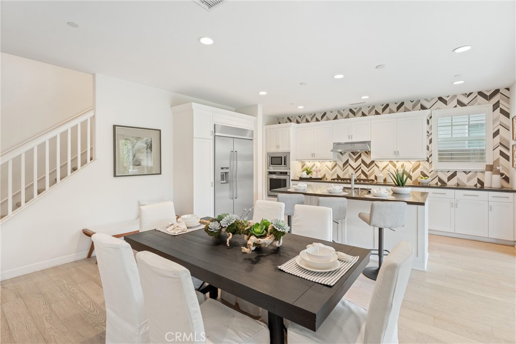 287 Barnes Road Tustin, CA 92782 - Photo 14 of 54 a view of a dining room with furniture and wooden floor