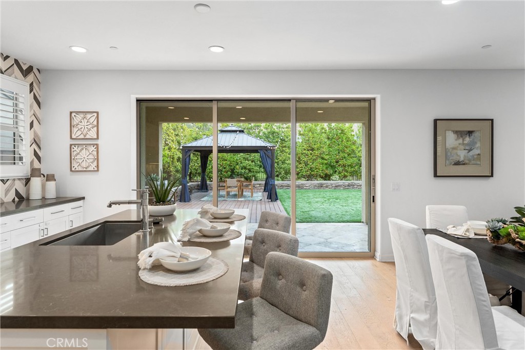 287 Barnes Road Tustin, CA 92782 - Photo 16 of 54 a view of a dining room with furniture window and outside view