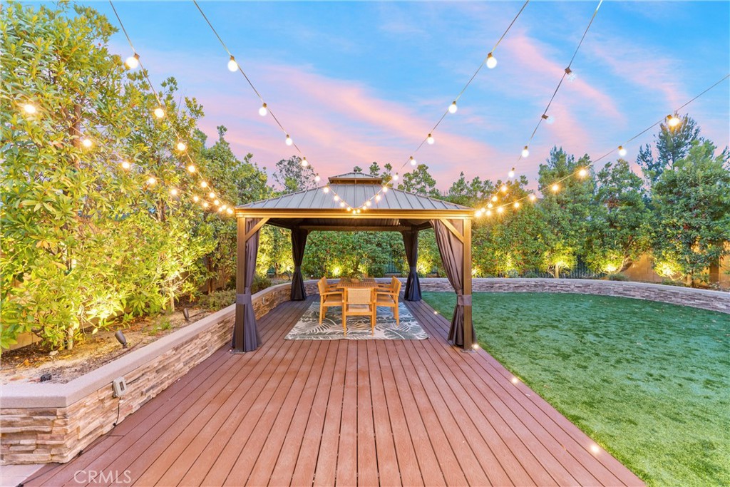 287 Barnes Road Tustin, CA 92782 - Photo 19 of 54 a view of a patio with swimming pool