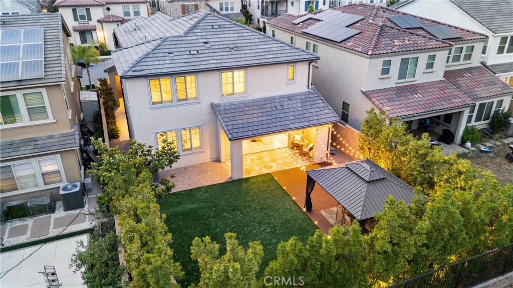 287 Barnes Road Tustin, CA 92782 - Photo 22 of 54 a aerial view of a house with a yard and potted plants