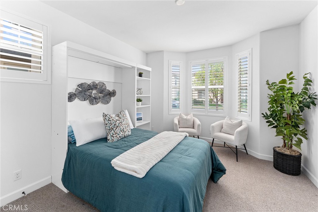 287 Barnes Road Tustin, CA 92782 - Photo 23 of 54 a bedroom with furniture and a potted plant