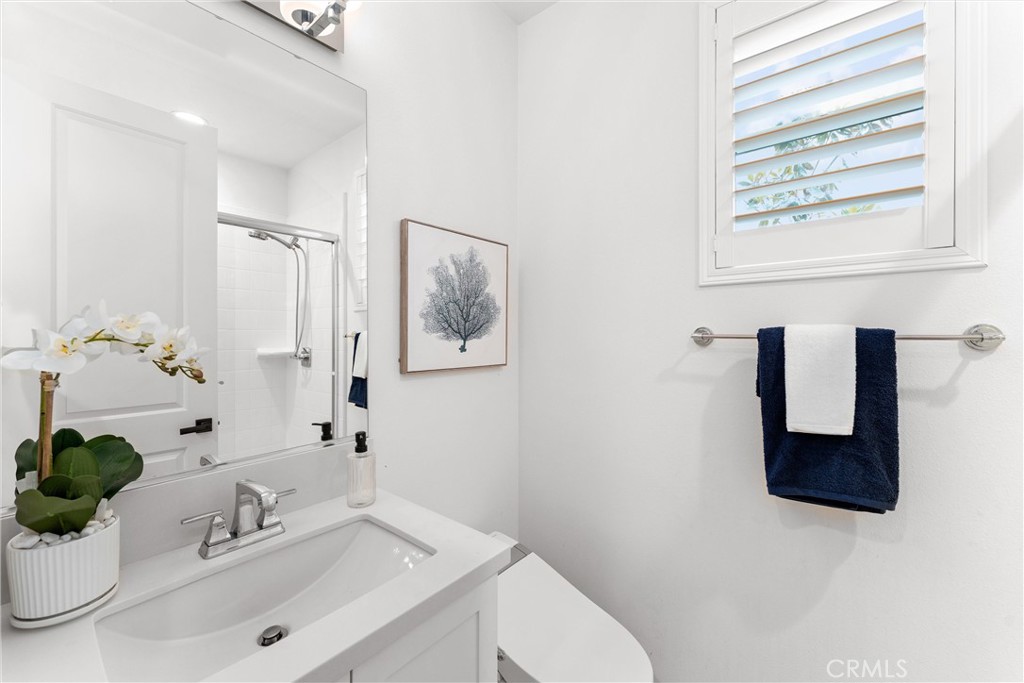 287 Barnes Road Tustin, CA 92782 - Photo 24 of 54 a bathroom with a sink mirror and vanity