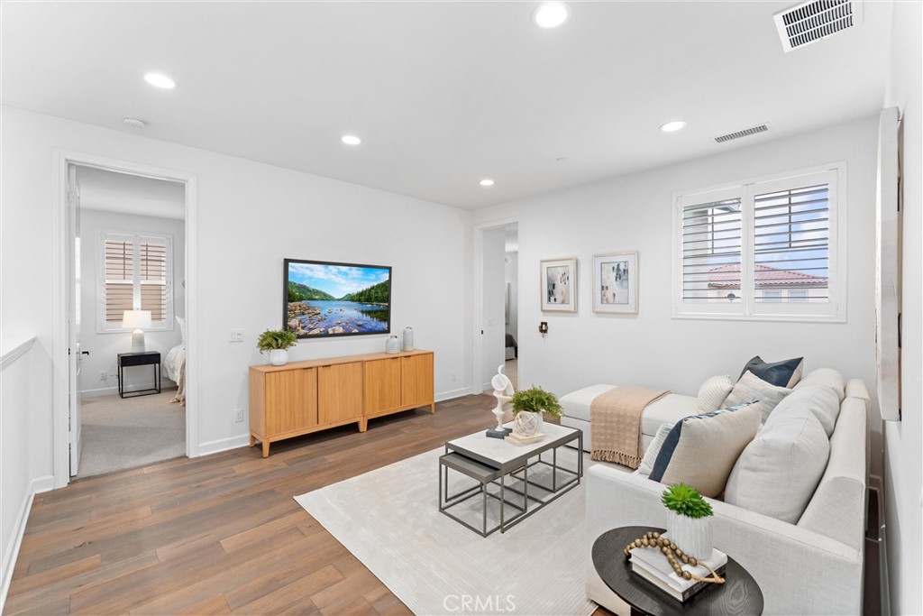 287 Barnes Road Tustin, CA 92782 - Photo 25 of 54 a living room with furniture and a flat screen tv