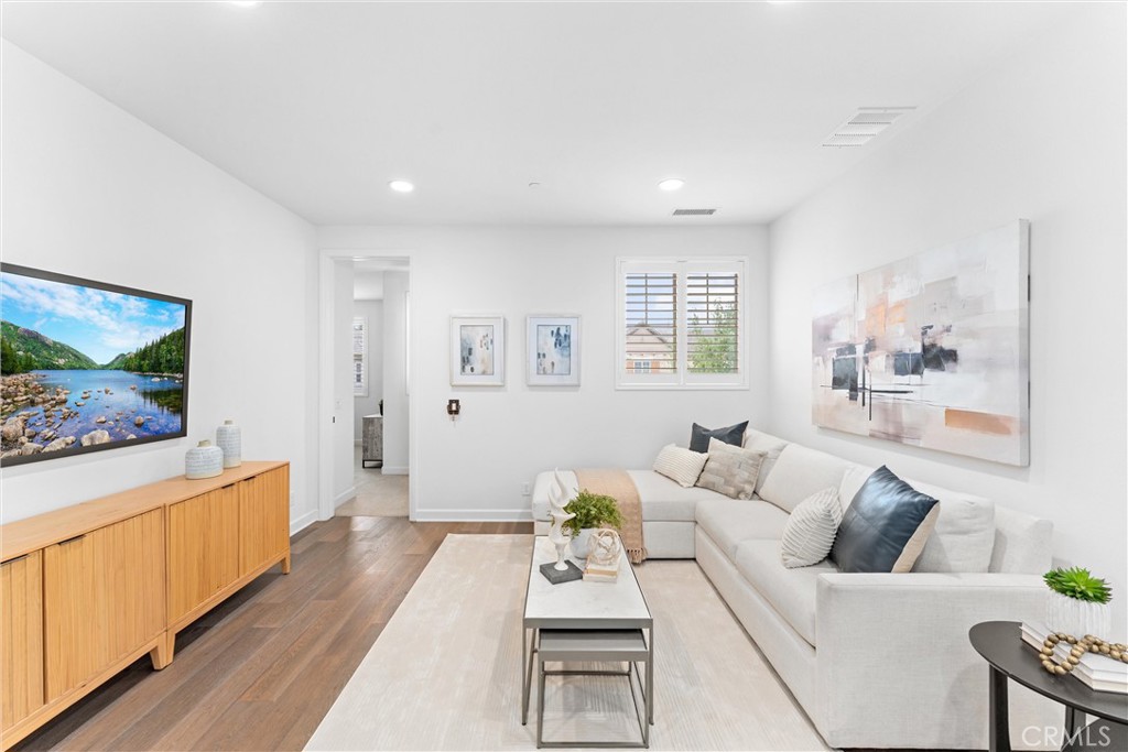 287 Barnes Road Tustin, CA 92782 - Photo 26 of 54 a living room with furniture and a flat screen tv