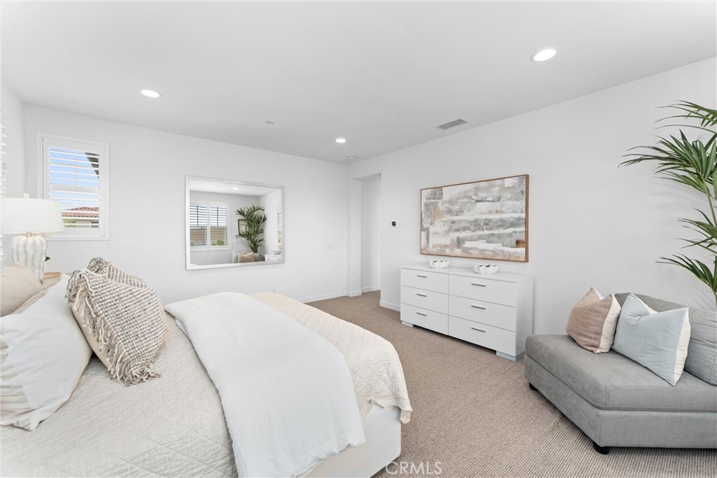 287 Barnes Road Tustin, CA 92782 - Photo 29 of 54 a bedroom with a bed and furniture