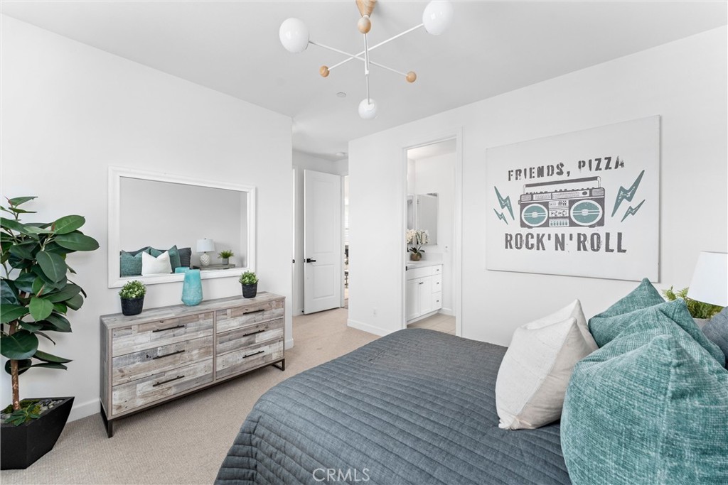 287 Barnes Road Tustin, CA 92782 - Photo 35 of 54 a spacious bedroom with a bed and a couch