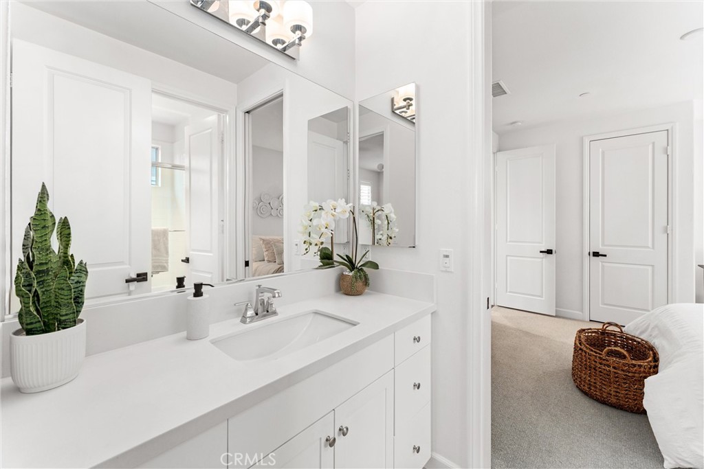 287 Barnes Road Tustin, CA 92782 - Photo 36 of 54 a bathroom with a sink a mirror and a shower