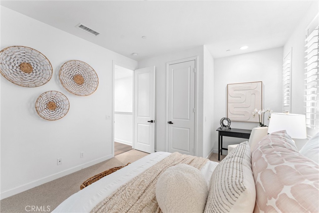 287 Barnes Road Tustin, CA 92782 - Photo 38 of 54 a bedroom with a bed and a window