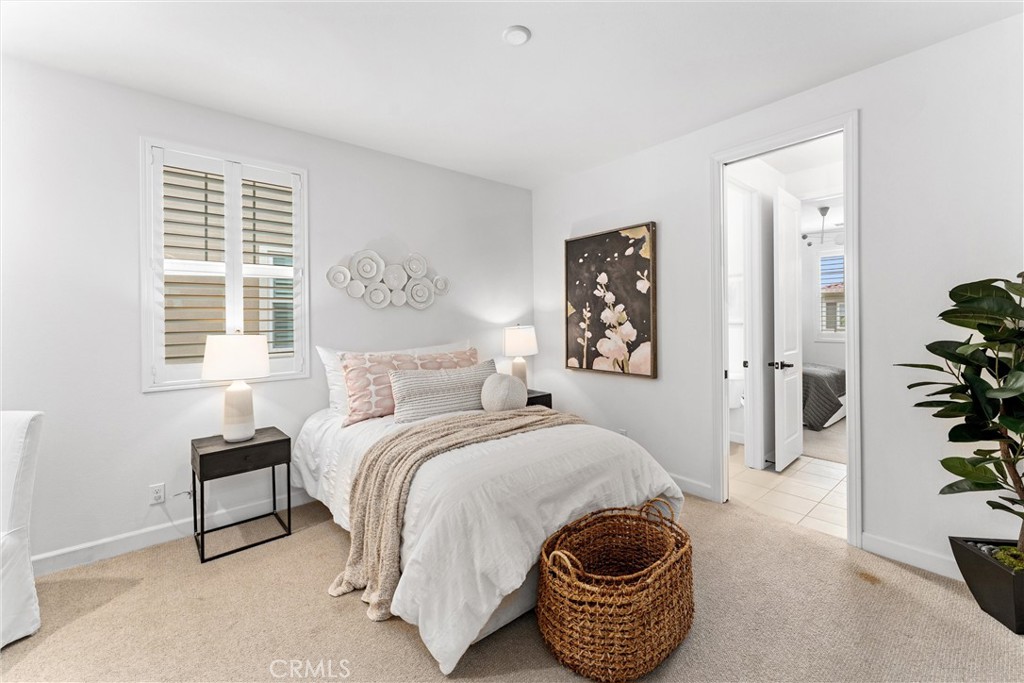 287 Barnes Road Tustin, CA 92782 - Photo 39 of 54 a bedroom with a bed and a painting on the wall