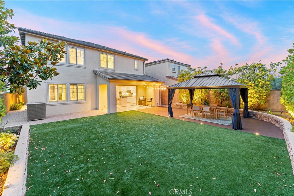 287 Barnes Road Tustin, CA 92782 - Photo 4 of 54 a view of house with a big yard