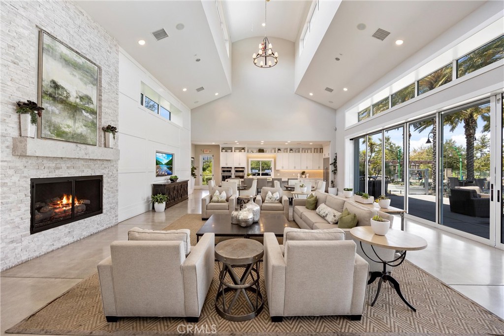 287 Barnes Road Tustin, CA 92782 - Photo 47 of 54 a living room with furniture a fireplace and a large window