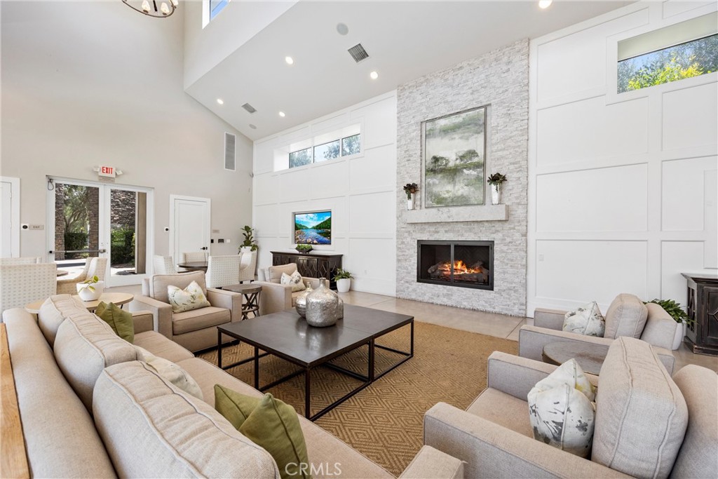287 Barnes Road Tustin, CA 92782 - Photo 52 of 54 a living room with furniture and a fireplace
