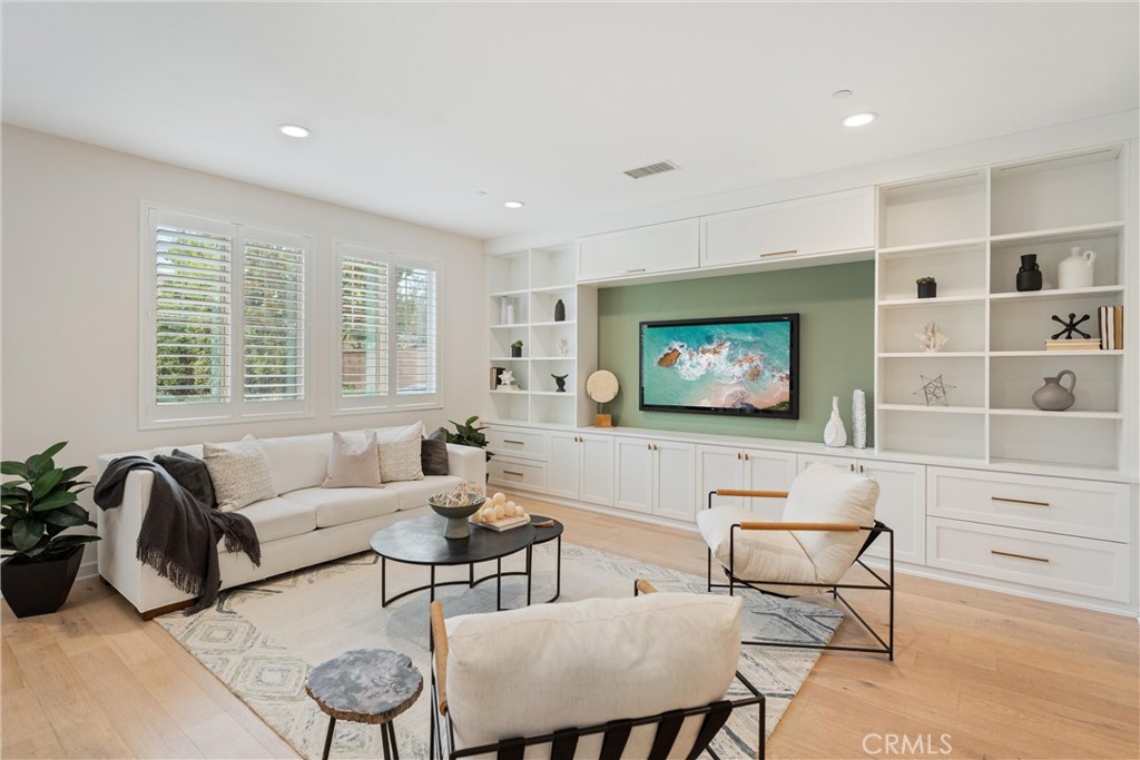 287 Barnes Road Tustin, CA 92782 - Photo 7 of 54 a living room with furniture and a flat screen tv