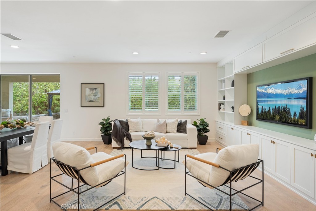 287 Barnes Road Tustin, CA 92782 - Photo 8 of 54 a living room with furniture and a flat screen tv