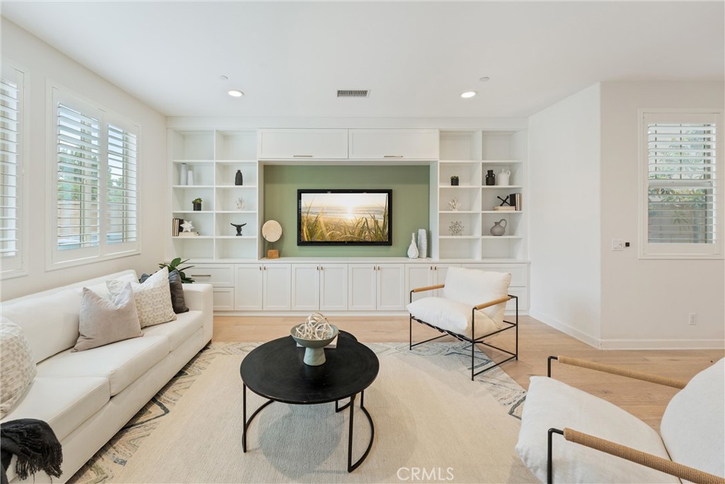 287 Barnes Road Tustin, CA 92782 - Photo 9 of 54 a living room with furniture and a flat screen tv