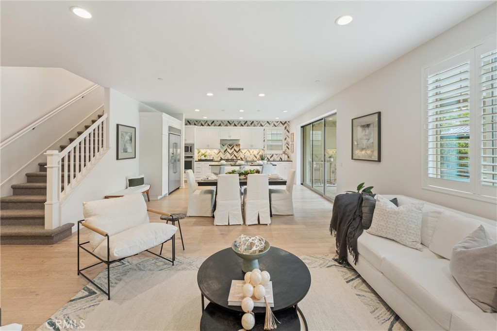 287 Barnes Road Tustin, CA 92782 - Photo 10 of 54 a living room with furniture and kitchen view
