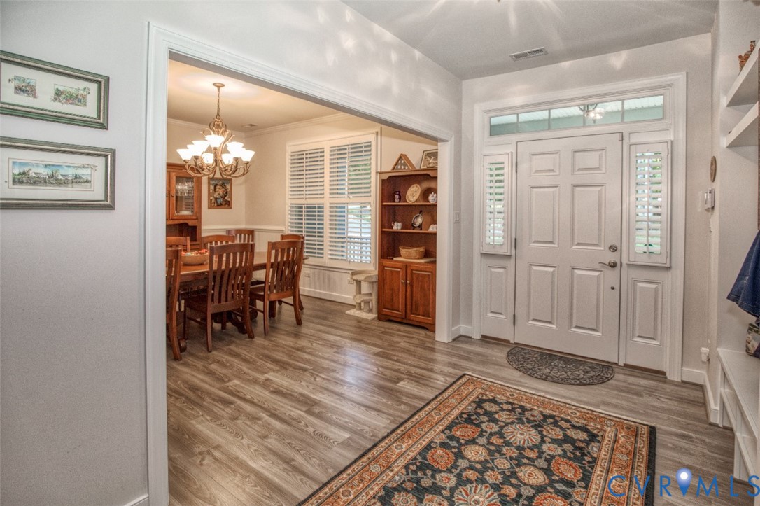 7075 Menzels Road Toano, VA 23168 - Photo 7 of 50 Entryway featuring wood-finish flooring, a six-pan