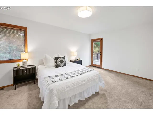 a bedroom with a bed and a mirror