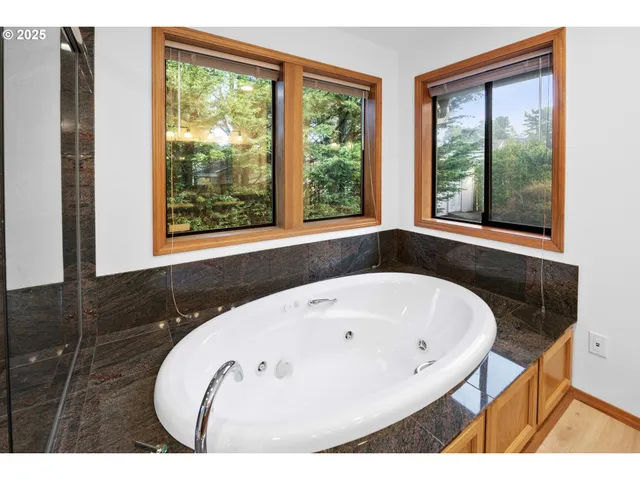 a bathroom with double vanity sinks and a mirror