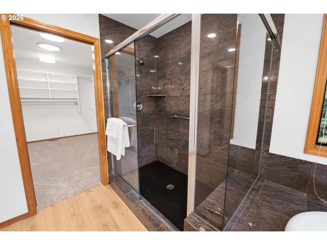 a house view with swimming pool in front of it