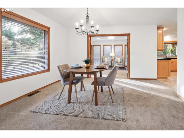 a dining room with furniture and window