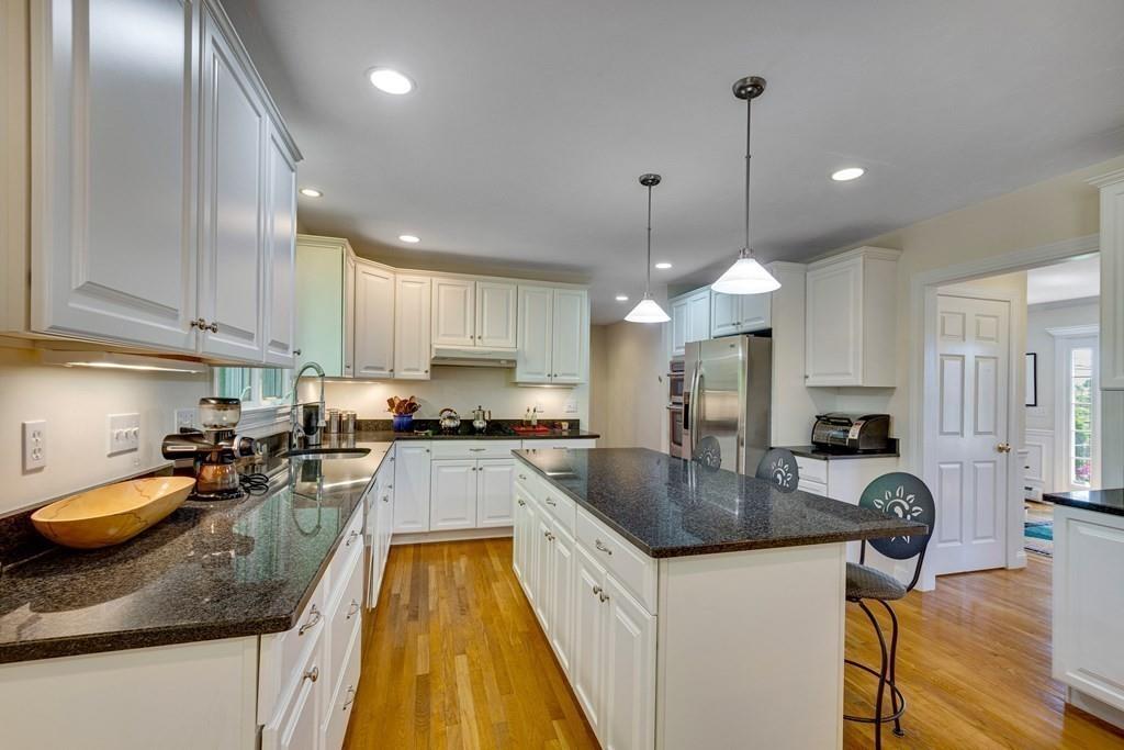 65 Wachusett Road Needham, MA 02492 - Photo 17 of 42 a kitchen with granite countertop a sink a counter top space appliances and cabinets