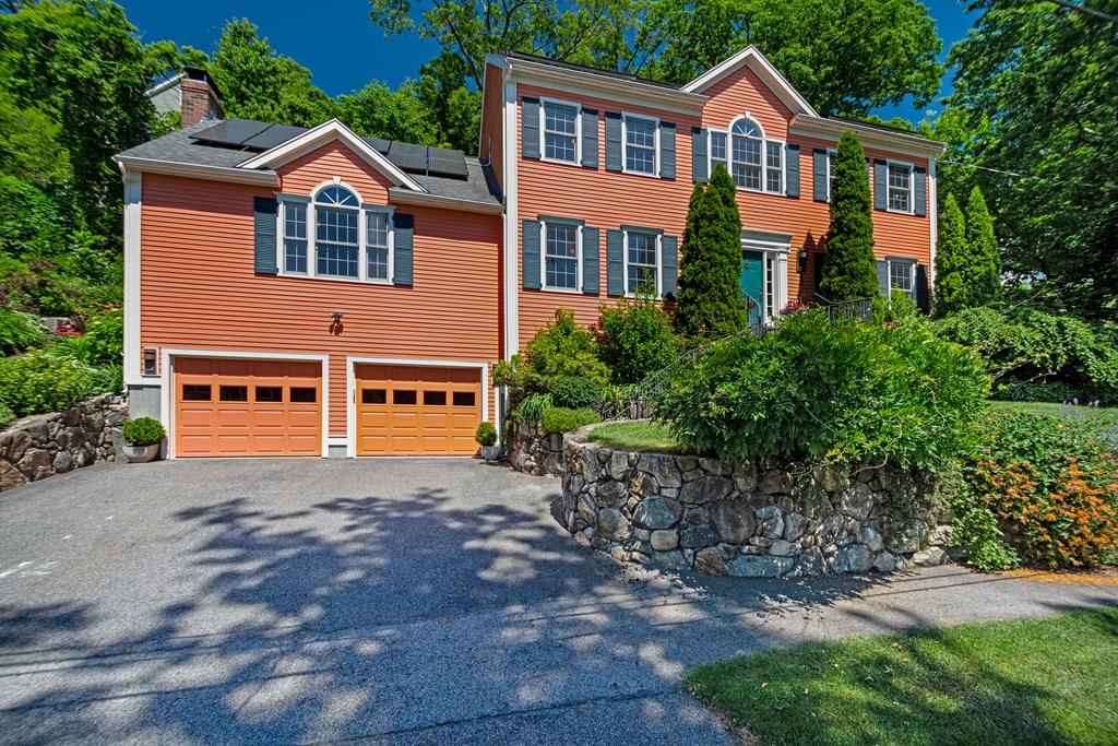 65 Wachusett Road Needham, MA 02492 - Photo 2 of 42 a front view of a house with a garden and yard